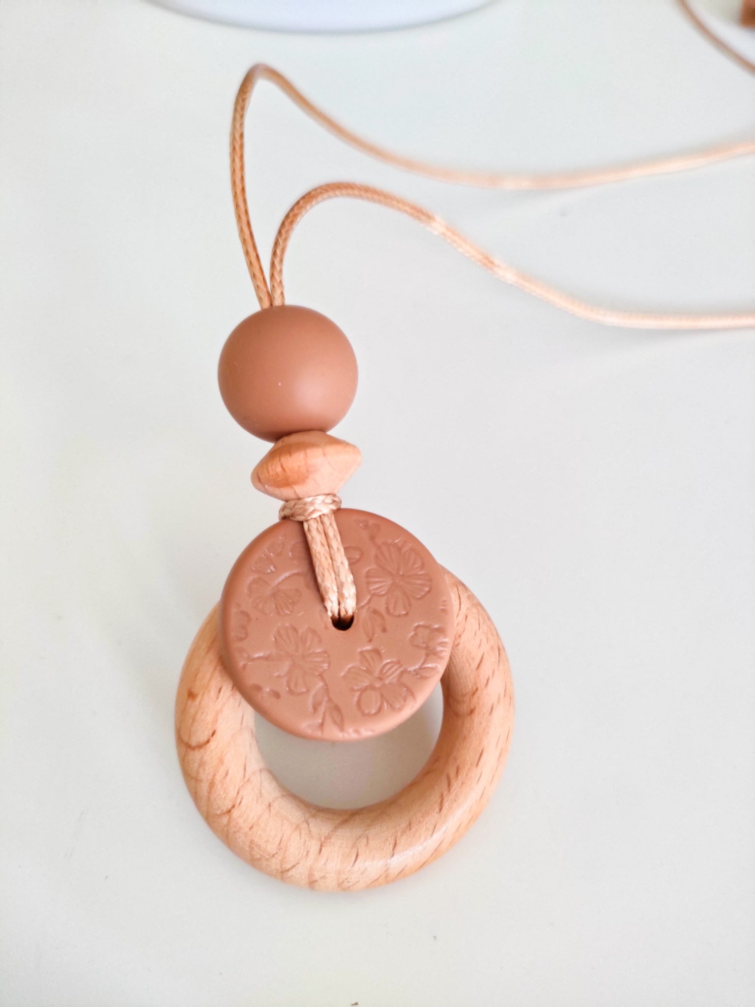 Embossed Clay Bloom Pendant - Bennie Blooms Breastfeeding, Teething and Fiddle Jewellery at its finest.