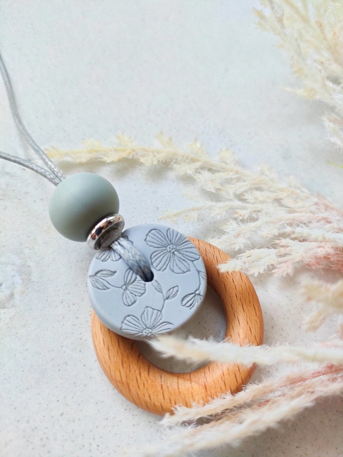 Embossed grey Bloom Pendant - Bennie Blooms Breastfeeding, Teething and Fiddle Jewellery at its finest.