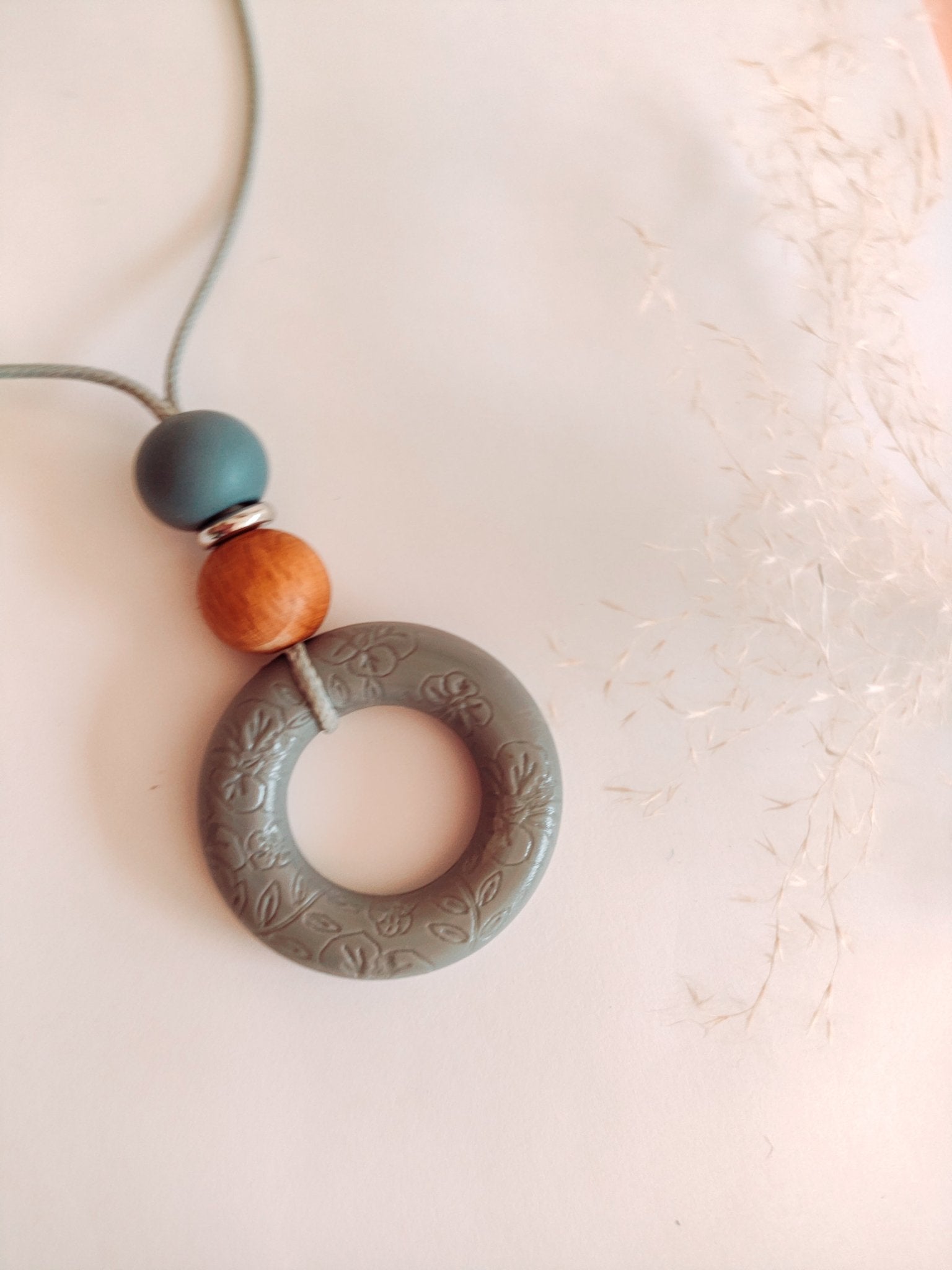 Embossed Soft Bloom Grey Pendant - Bennie Blooms Breastfeeding, Teething and Fiddle Jewellery at its finest.